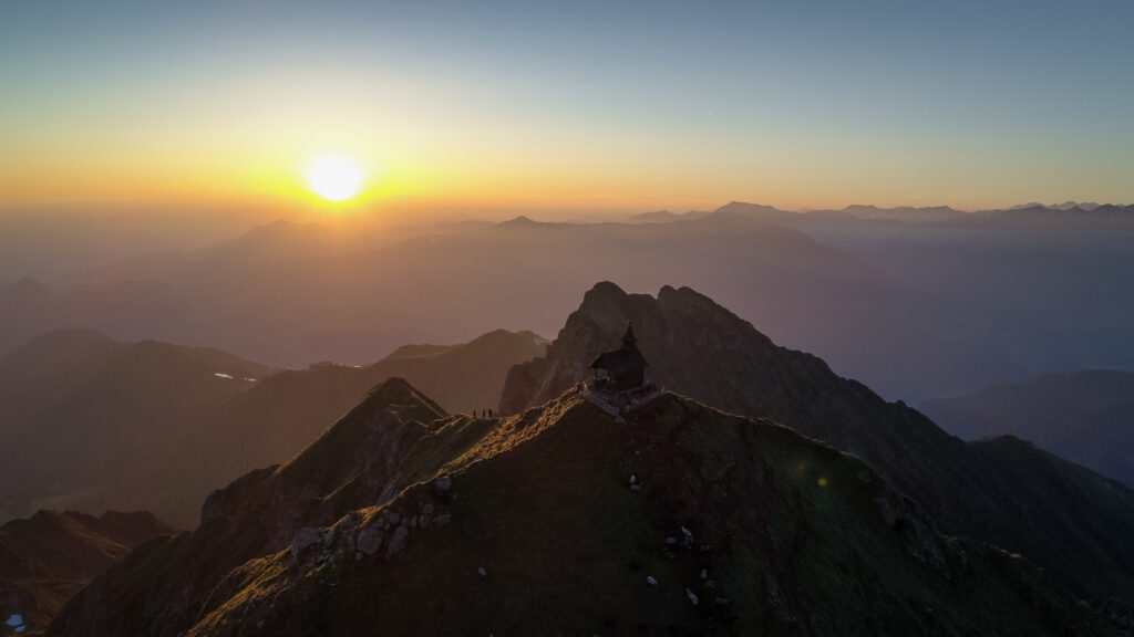 Enjoying the magic of sunrise on top of the Kellerjoch mountain